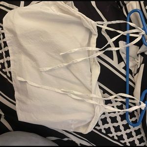 A white tank top with tied straps